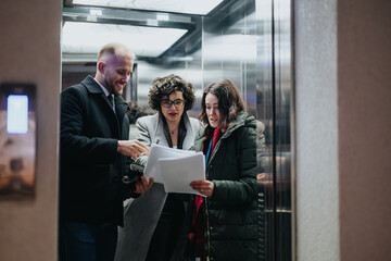 Three colleagues collaborating on project discussions near elevator in modern office.