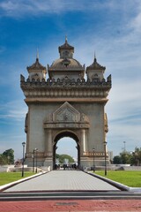 Fototapeta na wymiar Patuxai, a memorial monument, in Vientiane, Laos. Patuxai Gate in the Thannon Lanxing area. Victory Gate Monument, Laos Flag