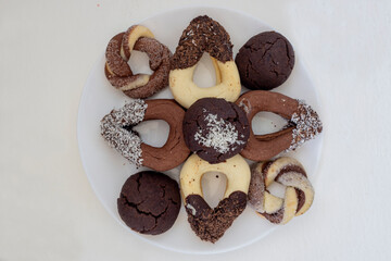 Biscuit cookies assortment on a white background, top view