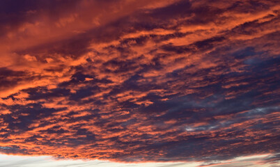 dramatic Red clouds for pattern background. A burning sky in a horror movie. crimson storm in apocalyptic, judgment day.
