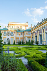 Obraz premium The royal Wilanow Palace in Warsaw, Poland. View of a gardens and facade.