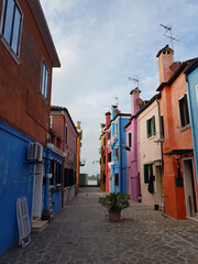 Fototapeta na wymiar An alley in Burano, Venice with colorful houses