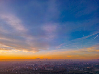 San Donato Milanese City in Italy with beautiful Sunset . Cityscape from drone. Italy, Lombardy,...