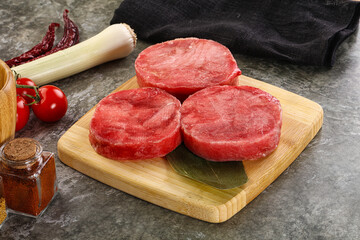 Delicous raw tuna medallion for cooking