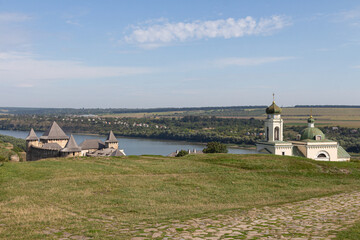 View of the historic Khotyn fortress and historical Church of Olexander Nevsky on a sunny day. Ukraine