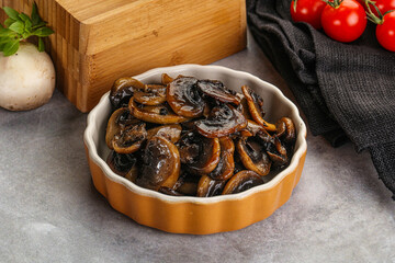 Roasted champignon mushrooms in the bowl
