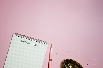 Do to list concept with blank notebook, pink pen over the sweet pink background. 