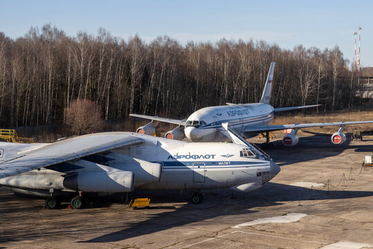 Sheremetyevo, Moscow region, Russia - April 6, 2023. Airplanes at the airport parking lot. On the planes the name of the airline is "Aeroflot". Transport aircraft Il-76T and passenger aircraft Il-86.