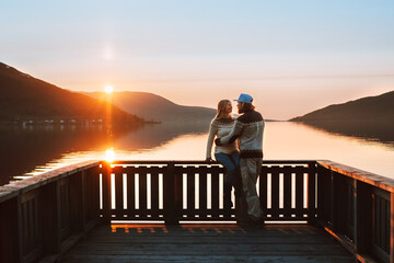 Romantic dating on Valentines day  couple in love together family travel lifestyle relationship friends man and woman walking on pier enjoying sunset view outdoor lake and mountains landscape