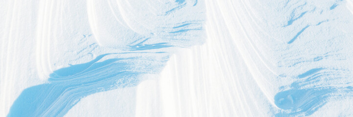 Snow texture. Wind sculpted patterns on snow surface. Wind in the tundra and in the mountains on...