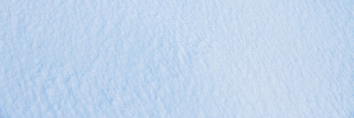 Natural snow texture. Smooth surface of clean fresh snow. Snowy ground. Winter background with snow...