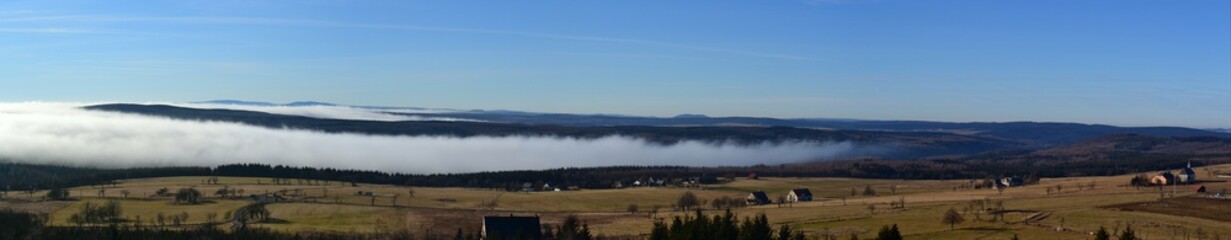 Fototapeta premium panorama of the mountains with fog