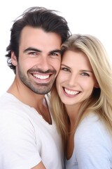 studio shot of a happy young couple standing together against a white background
