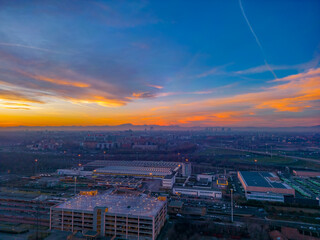 San Donato Milanese City in Italy with beautiful Sunset . Cityscape from drone. Italy, Lombardy, Milan, San Donato Milanese