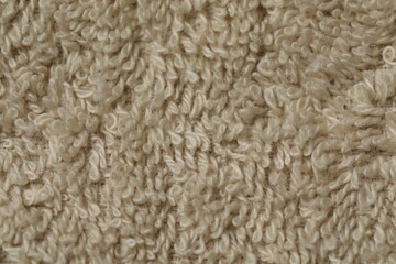 Texture of soft beige fabric as background, top view