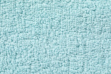 Fototapeta na wymiar Texture of soft light blue fabric as background, top view
