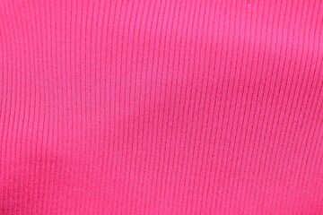 Fototapeta premium Texture of pink fabric as background, top view
