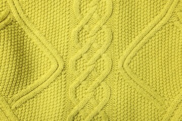 Texture of soft yellow fabric as background, top view