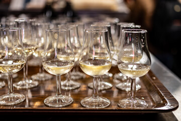 Many small tasting glasses of sparkling wine champagne on winter festival in December, Avenue de Champagne, Epernay, Champagne region, France
