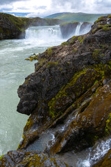 waterfall in the mountains. raw beauty of icelandic nature