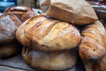 Sour dough bio bread made with natural yeast starter and baked in wood stove on market in France
