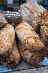 Sour dough bio bread made with natural yeast starter and baked in wood stove on market in France