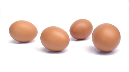 several brown chicken eggs on an isolated background