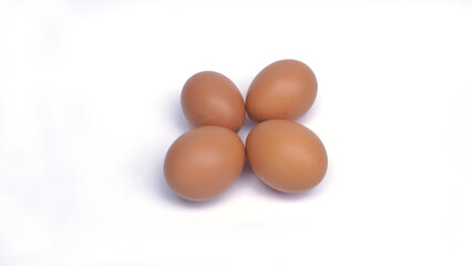several brown chicken eggs on an isolated background