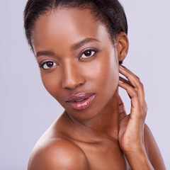 Face, black woman and natural beauty, cosmetics and wellness with makeup on white background. Healthy glow, skincare and dermatology, model in portrait and facial for skin treatment in studio