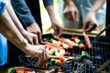 Group of senior man woman friend BBQ grill party in home garden