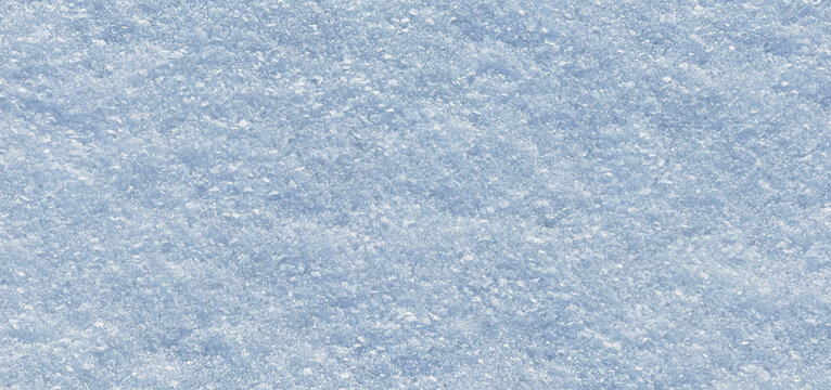 Surface of natural snow close-up. Blue snow background with small ice crystals