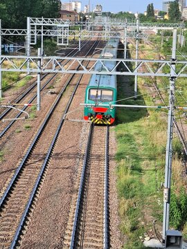 evocative image of the panoramic view of the train tracks from an elevated road in Italy
