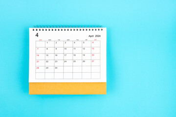 April 2024, Monthly desk calendar for 2024 year on blue background.