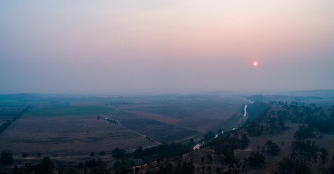 Thick smoke haze over farmland in hunter valley from bushfires