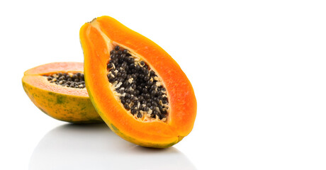Papaya fruit isolated on white background. Halved fresh organic Papaya exotic fruits close up. Healthy vegan food