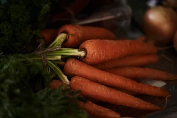 Fototapeten Closeup, carrot and food for health and cooking, wellness and nutrition with vegan or vegetarian meal prep. Orange vegetables, organic produce and cuisine with dinner or lunch ingredients for diet © peopleimages.com