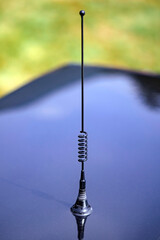 Radio antenna on a vintage car