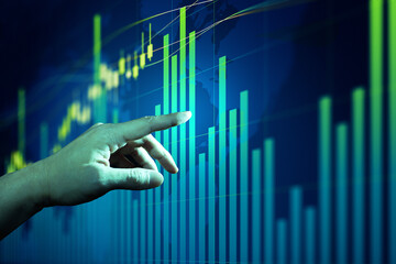 Businessman hand analysing financial stock market graph on board. Trading data index investment...