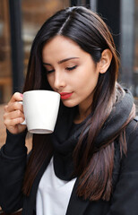 portrait of a woman drinking coffee