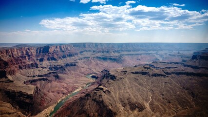 Fototapeta na wymiar Drone view of a river in the Grand Canyon in the United States under blue cloudy sky