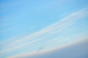 Fototapeta premium A beautiful sky tinted by the sun leaving vibrant shades of gold, pink, blue and multicolored. Clouds in the twilight evening and morning sky. Cloudy sky background in the evening and during the day.