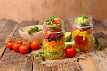 Vegetable salad in glass jar, rainbow mixed salad- health food, vegetarian food
