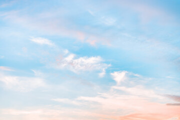 A beautiful sky tinted by the sun leaving vibrant shades of gold, pink, blue and multicolored. Clouds in the twilight evening and morning sky. Cloudy sky background in the evening and during the day.
