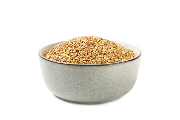 Green buckwheat in a bowl isolated on a white background. Superfood. Raw buckwheat porridge. Healthy vegan food, eco products, diet, organic.