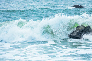 Wave splashing close-up. Crystal clear sea water, in the ocean in San Francisco Bay, blue water, pastel colors.