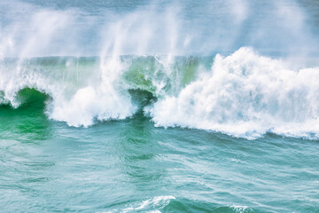 Wave splashing close-up. Crystal clear sea water, in the ocean in San Francisco Bay, blue water, pastel colors.