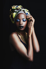 Fashion, beauty and face of African woman on dark background with confidence, style and head scarf. Culture, aesthetic and person with cosmetics, trendy accessories and makeup in studio in Kenya