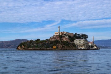 Scenic view of old buildings against a cloudy blue sky on Alcatraz Island, San Francisco
