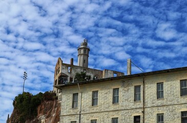 Scenic view of old buildings against a cloudy blue sky on Alcatraz Island, San Francisco