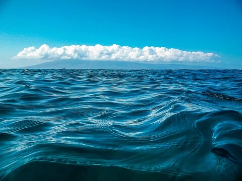 Stunning, crystal-clear ocean shoreline, with waves rolling
